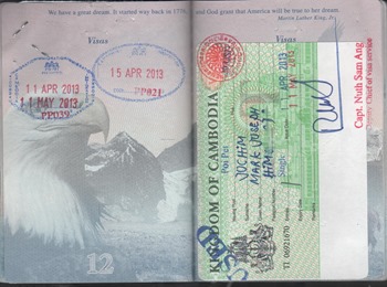 My passport with Cambodian visa and Poipet entry/departure stamps.